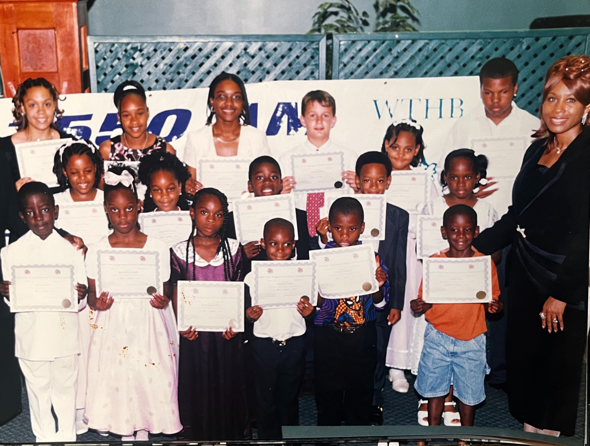 Mary Kingcannon with Honor Student Program graduates at WTHB 1550 AM