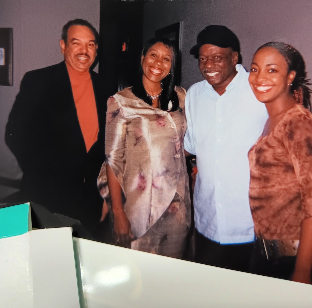 Mary in a floral wrap dress with family and friends